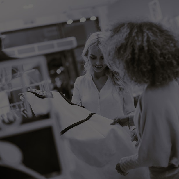 Two pretty young women choosing clothes from new c 2025 02 22 07 04 26 utc