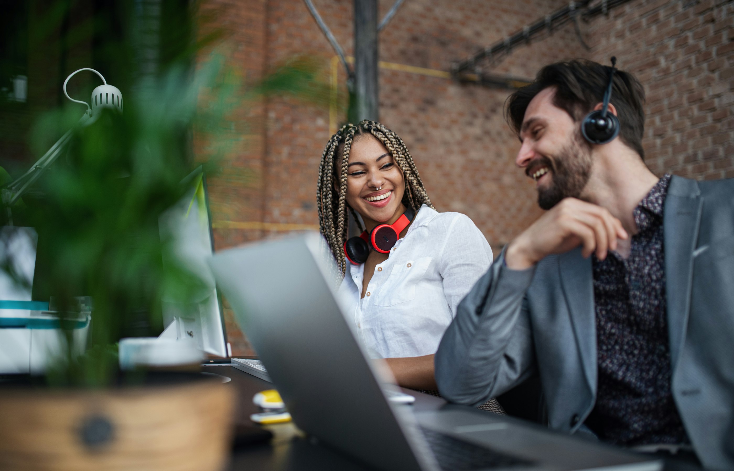 Cheerful young businesspeople sitting and working 2024 10 18 17 42 15 utc